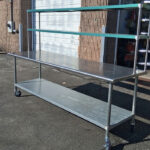 8ft table with a double overhead shelf